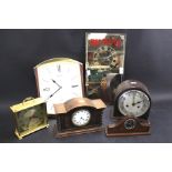An assortment of mantel and wall clocks.