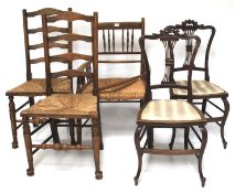 A selection of three rush-seated country chairs.