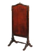 A Victorian stained pine rising fire screen.