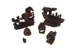 A group of Chinese red resin figures and animals.
