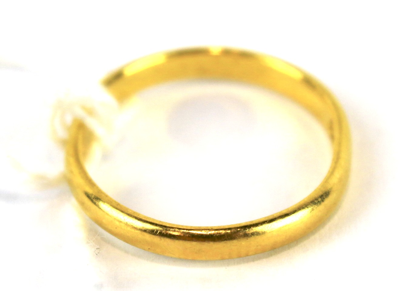 A 22ct gold wedding band.