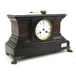 A late 19th century French slate and stone set mantel clock.