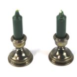 A pair of Elizabeth II squat silver candlesticks.