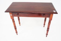 A Victorian mahogany single drawer desk.
