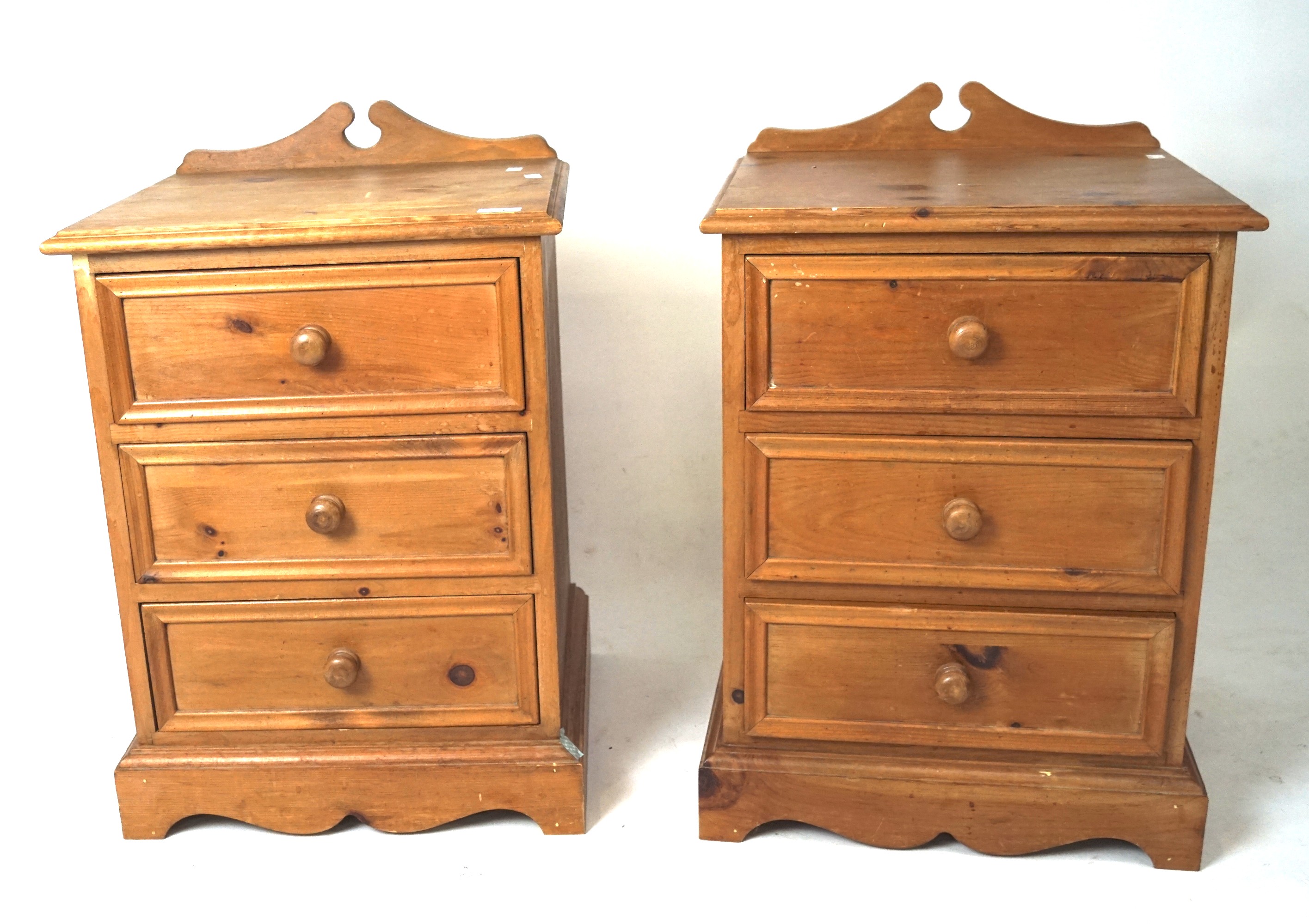 A pair of 20th century pine bedside chests.