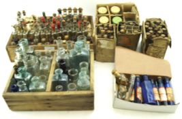 A large collection of vintage small glass essence and medicine bottles.