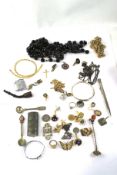 An assortment of costume jewellery and other items. To include chains,.