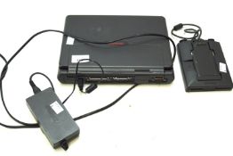 A Compaq series 2830A laptop including external floppy disc drive.