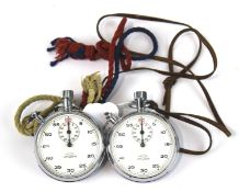 Two Lemania stop watches. Both with white dials, one stamped 'B.B.C. 3400',