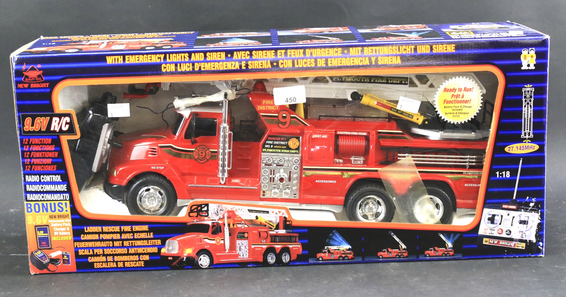 A boxed New Bright fire engine and remote control. With emergency lights and siren.