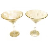 Two novelty oversized large Martini glasses.