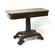 A 19th century rosewood fold over table.