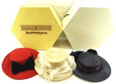 Three ladies' formal hats.