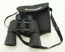 A cased pair of Komodo binoculars.