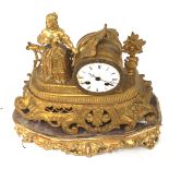 A gilt French style mantle clock.