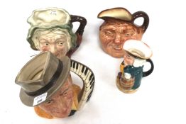 Four assorted character jugs. Including a Royal Doulton 'Jimmy Durante'