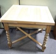 An extending oak dining table.
