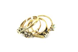 Four vintage 9ct gold ladies' rings. Including three gem set examples,