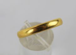 A 22ct gold wedding band.