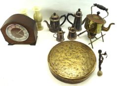 A brass spirit kettle mounted upon cross section stand and a large gong.