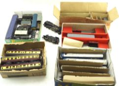 An assortment of model railway OO gauge trains and carriages.