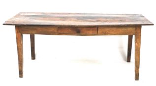 A 19th century stained plank top kitchen table.
