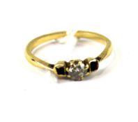 An unmarked yellow metal ladies gem set ring.