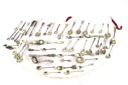 A large assortment of silver and silver plated flatware.