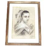 An Edwardian charcoal portrait. Depicting a young woman, signed and dated