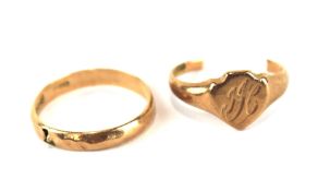 Two 9ct gold rings. One being a gents signet ring, the other a wedding band,