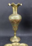 A pair of brass Eastern vases and two circular plates.