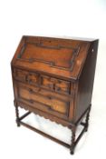 A late 20th century oak bureau.