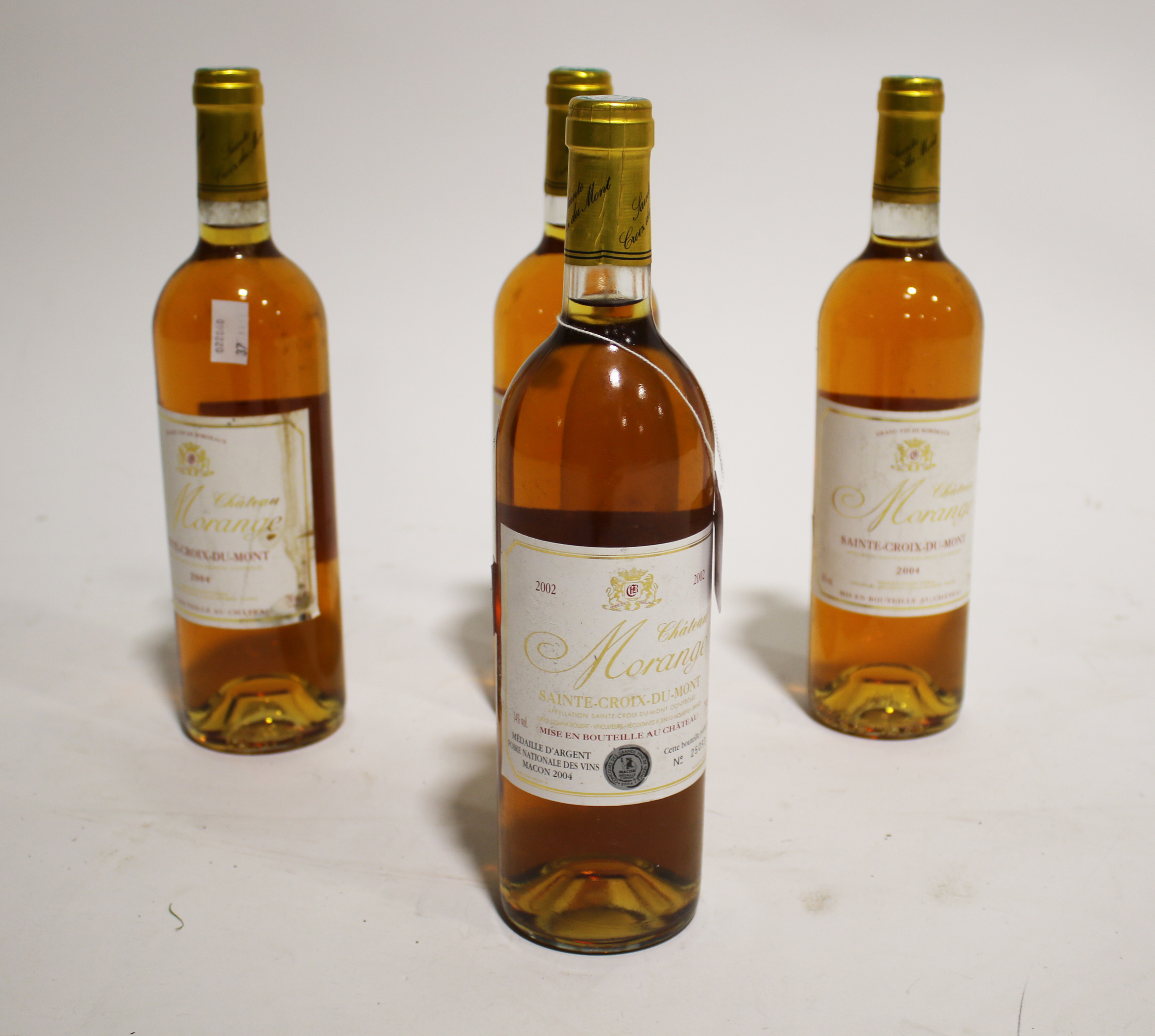 Four bottles of Chateau Morange Sainte-Croix-Du-Mont 2002 and 2004.