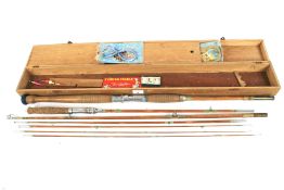 A cased E6150 split cane fishing rod