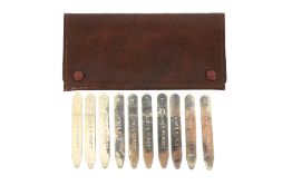 A set of 10 James Purdey silver grouse shooting peg markers.