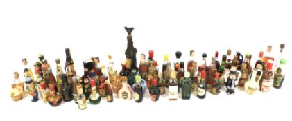 A large collection of vintage miniature bottles of alcohol.