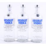 Three bottles of Absolut vodka,
