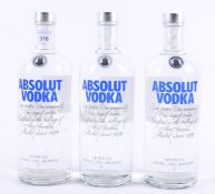 Three bottles of Absolut vodka,