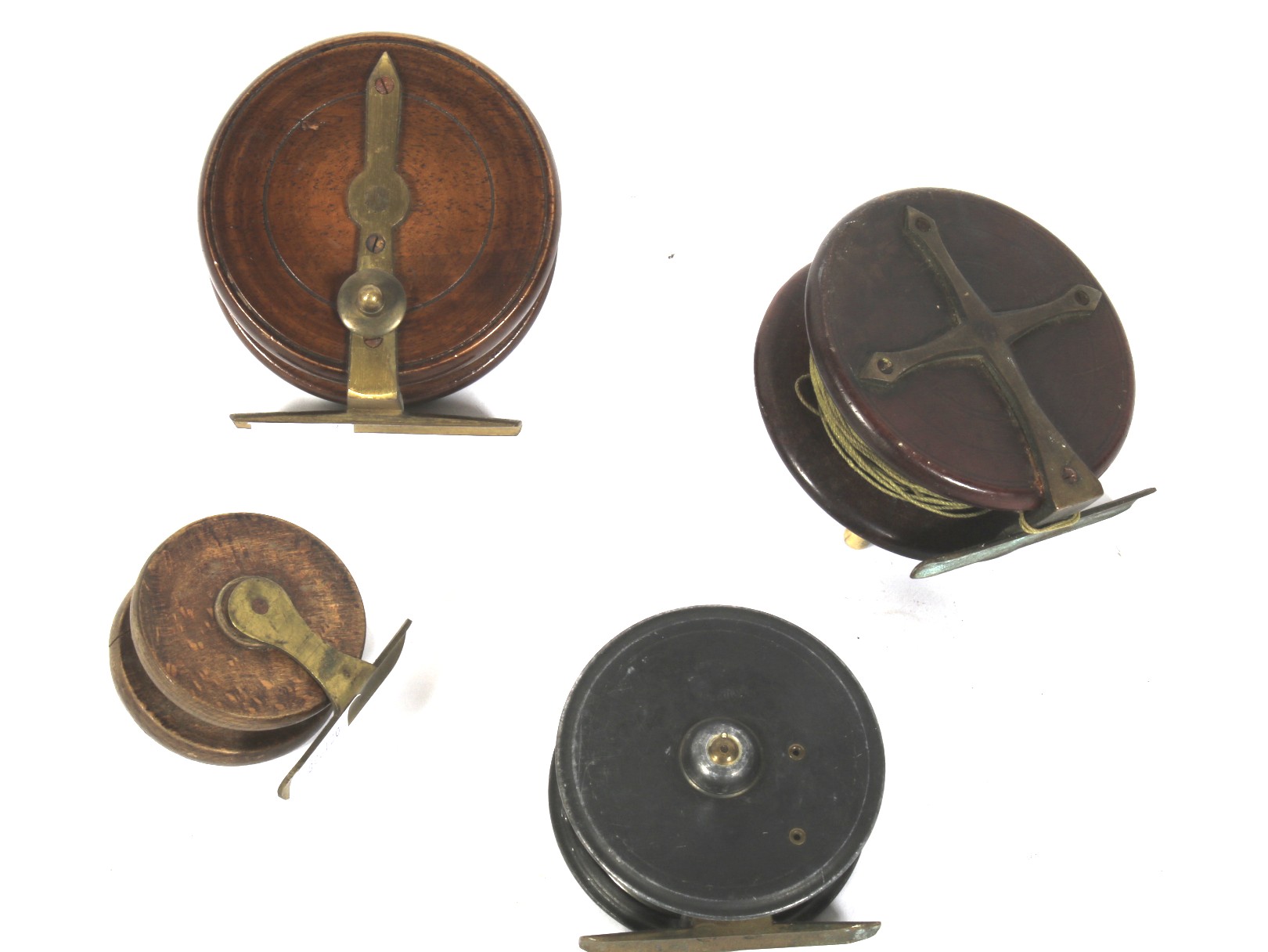 Four vintage fishing reels.