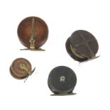 Four vintage fishing reels.