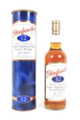 A bottle of Glenfarclas 12 years old Single Highland malt Scotch whisky in tin. 43% Vol.