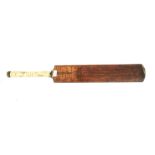 A vintage Stuart Surridge cricket bat.