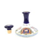 A British Navy Pussers Rum. In sealed Wade ceramic decanter with stopper, 54.5% Vol, 1 litre, 19.