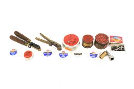 Percussion caps, two bullet moulds and related items.
