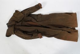 A waxed brown Driza-Bone riding coat.