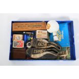 A box of assorted ephemera. Including football boots, playing cards, etc.