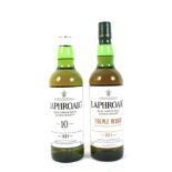 Two bottles of Laphroaig Islay ten year old single malt whisky.