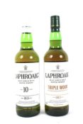 Two bottles of Laphroaig Islay ten year old single malt whisky.