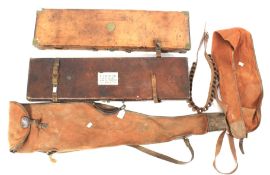 Two vintage leather gun cases, two gun sleeves and a leather cartridge belt.