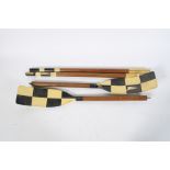 A pair of mid-20th century, wooden rowing oars.